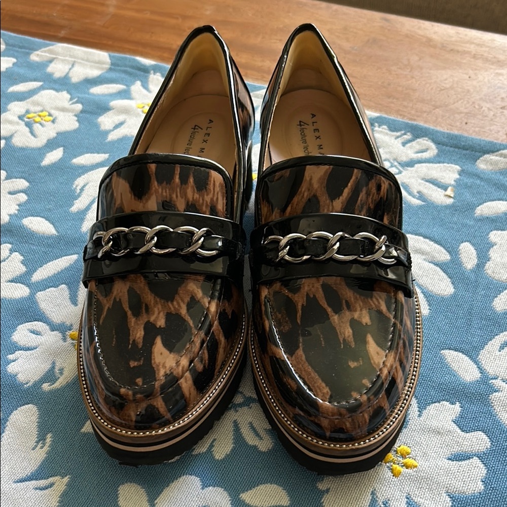 Alex Marie Brown and Black Flats with Chic Design